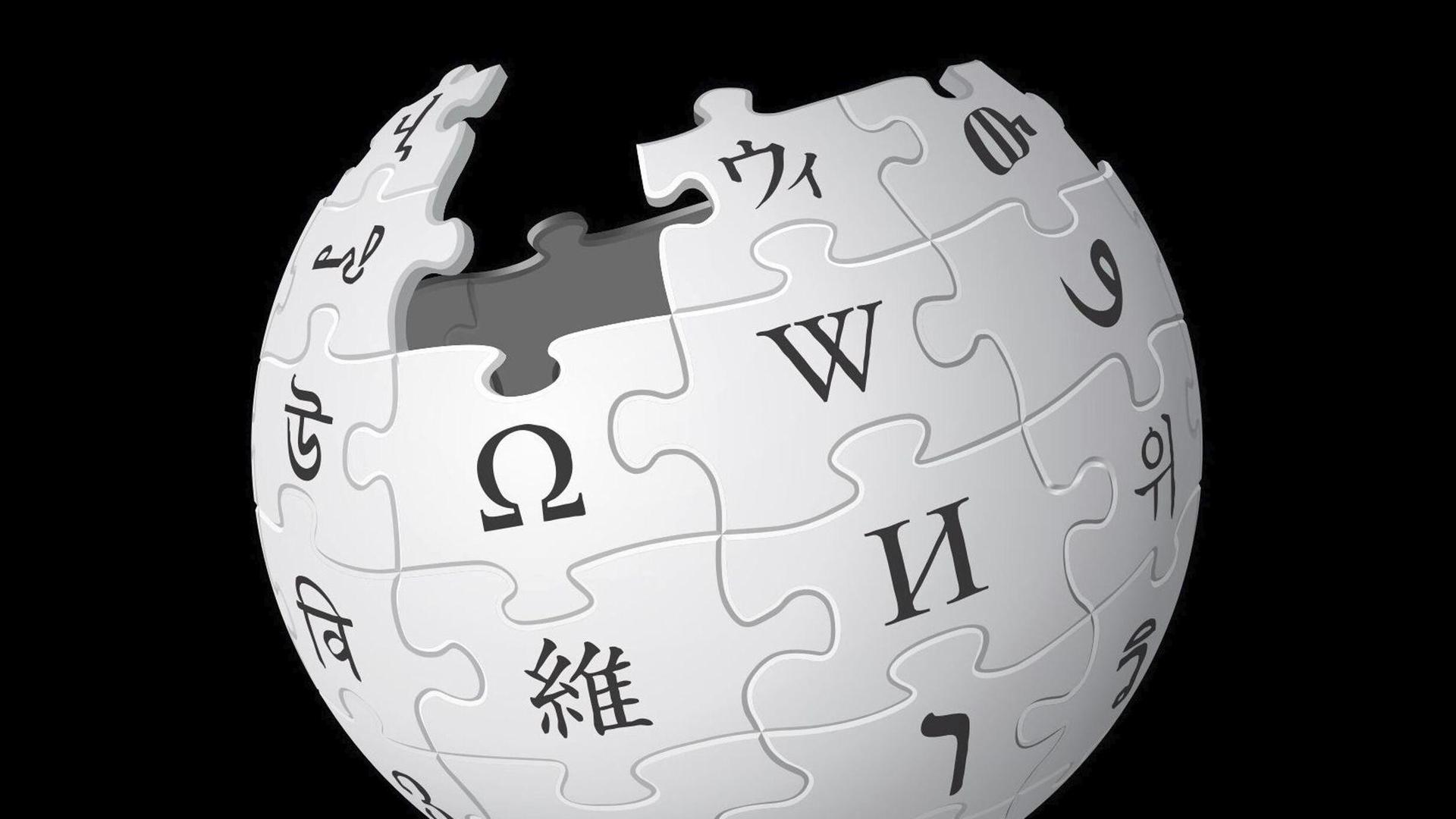 Das Logo von Wikipedia, ein Globus, der aus Puzzleteilen mit Buchstaben besteht.
