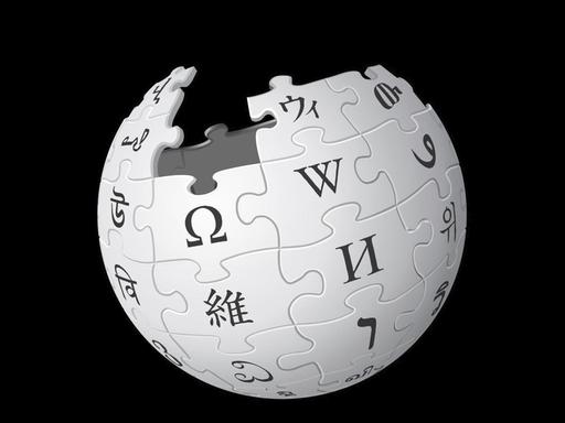 Das Logo von Wikipedia, ein Globus, der aus Puzzleteilen mit Buchstaben besteht.