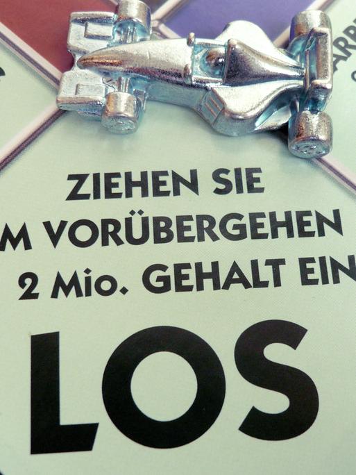 Das Symbolbild zeigt das Startfeld eines Monopolyspiels mit der Aufschrift "Ziehen Sie im Vorübergehen € 2 Mio. Gehalt ein."