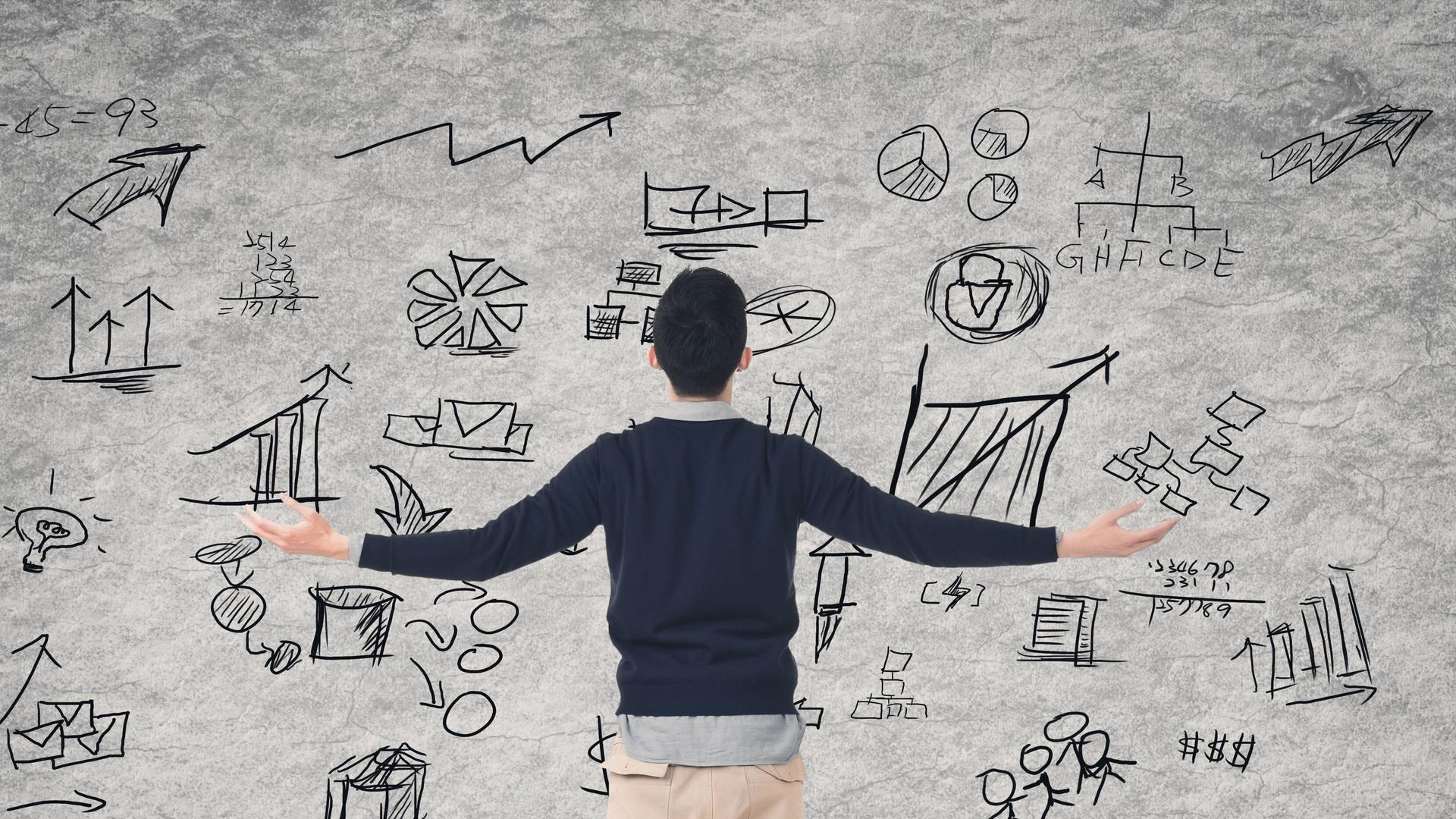 Grafische Darstellung: Einer Person steht mit ausgebreiteten Armen vor einer Tafel, auf der unterschiedliche Zeichnungen sind. Grafische Darstellung: Einer Person steht mit ausgebreiteten Armen vor einer Tafel, auf der unterschiedliche Zeichnungen sind.