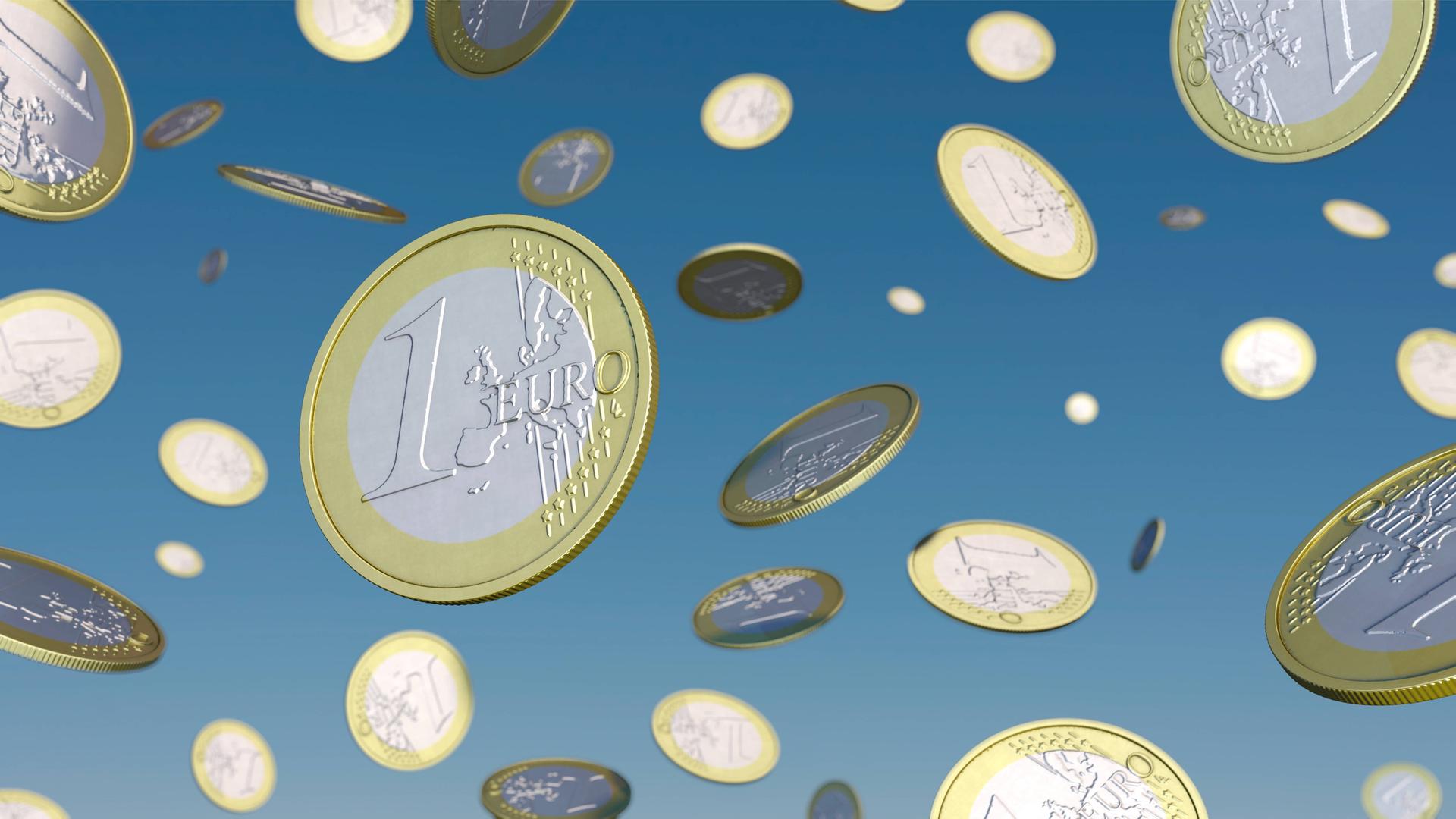 1-Euro-Münzen fallen vom Himmel.