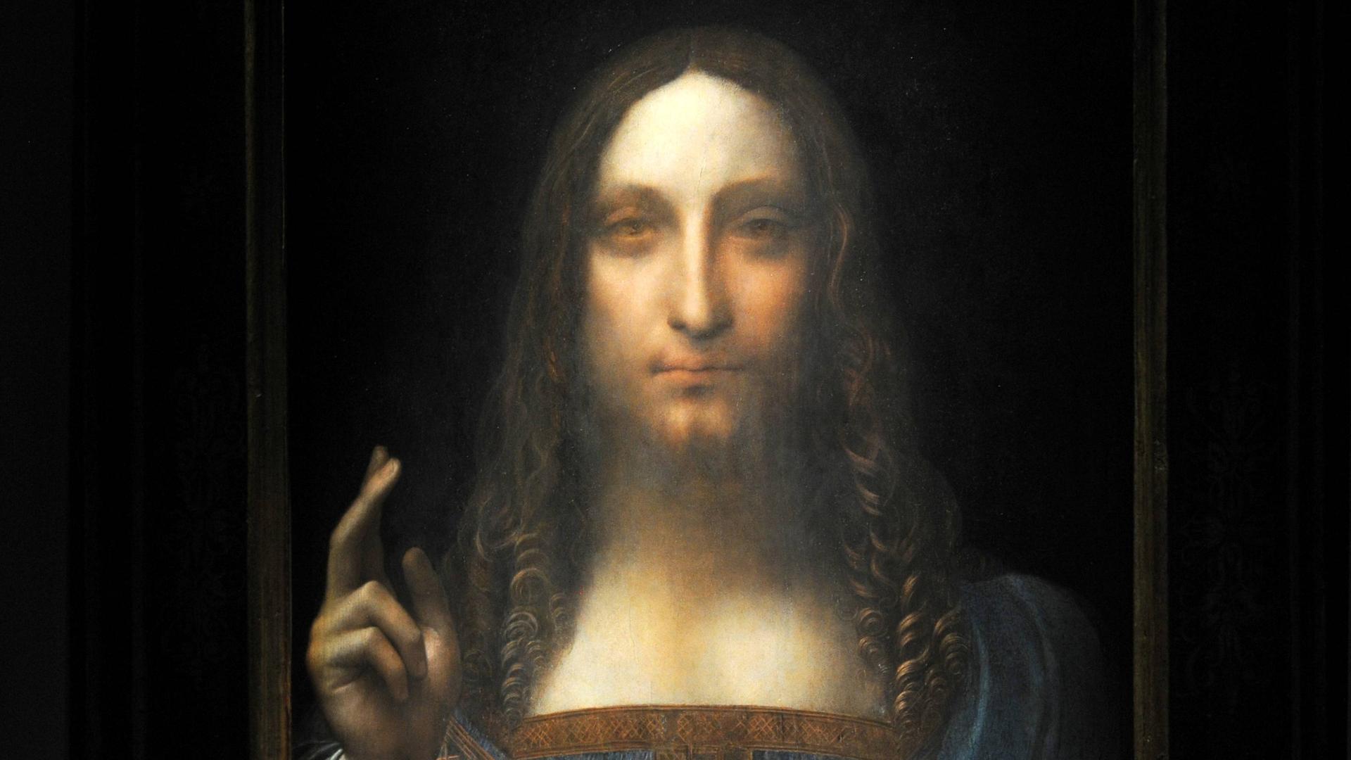 Leonardo da Vinci’s Salvator Mundi vor schwarzem Hintergrund.