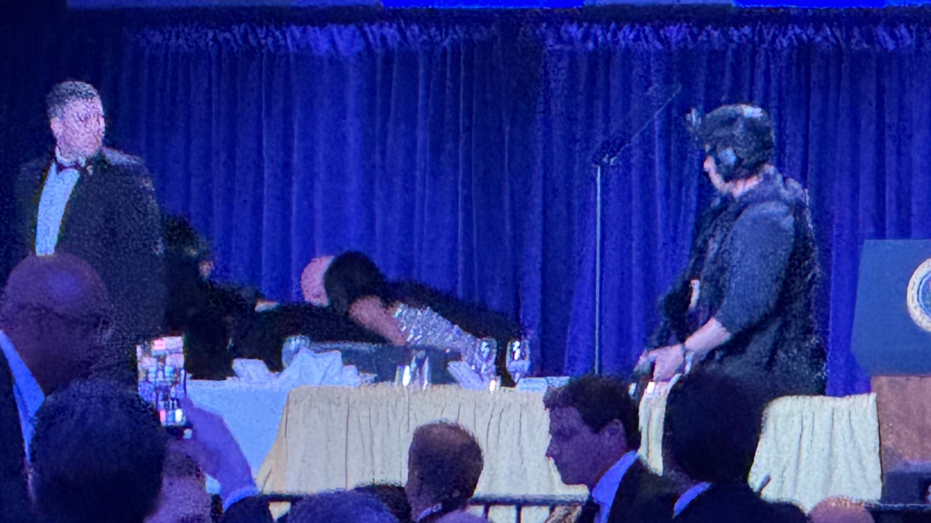 Secret service agents respond during the White House Correspondents Dinner, Saturday, April 25, 2026, in Washington. (AP Photo/Mark Schiefelbein)