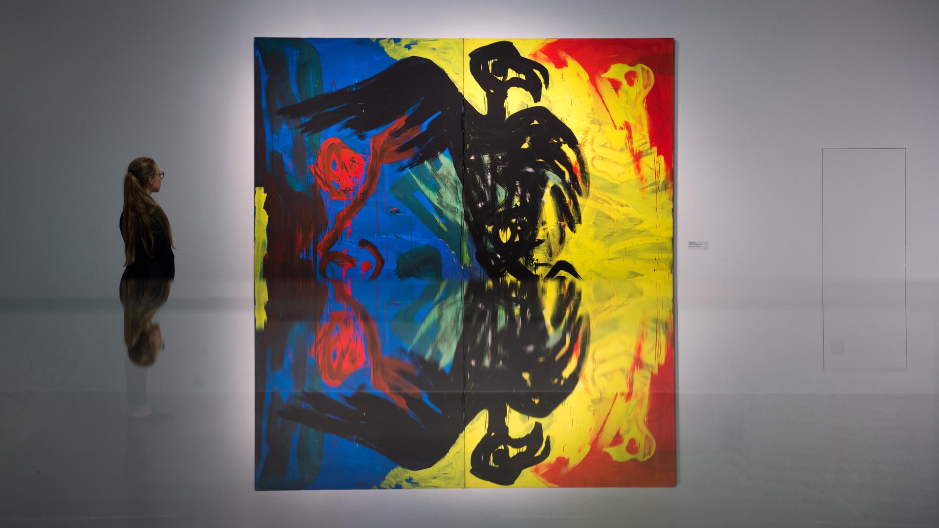 Das Gemälde "Der Zugriff" von Helge Leiberg aus dem Jahr 1980 in einer Ausstellung Das Gemälde "Der Zugriff" von Helge Leiberg aus dem Jahr 1980 in einer Ausstellung