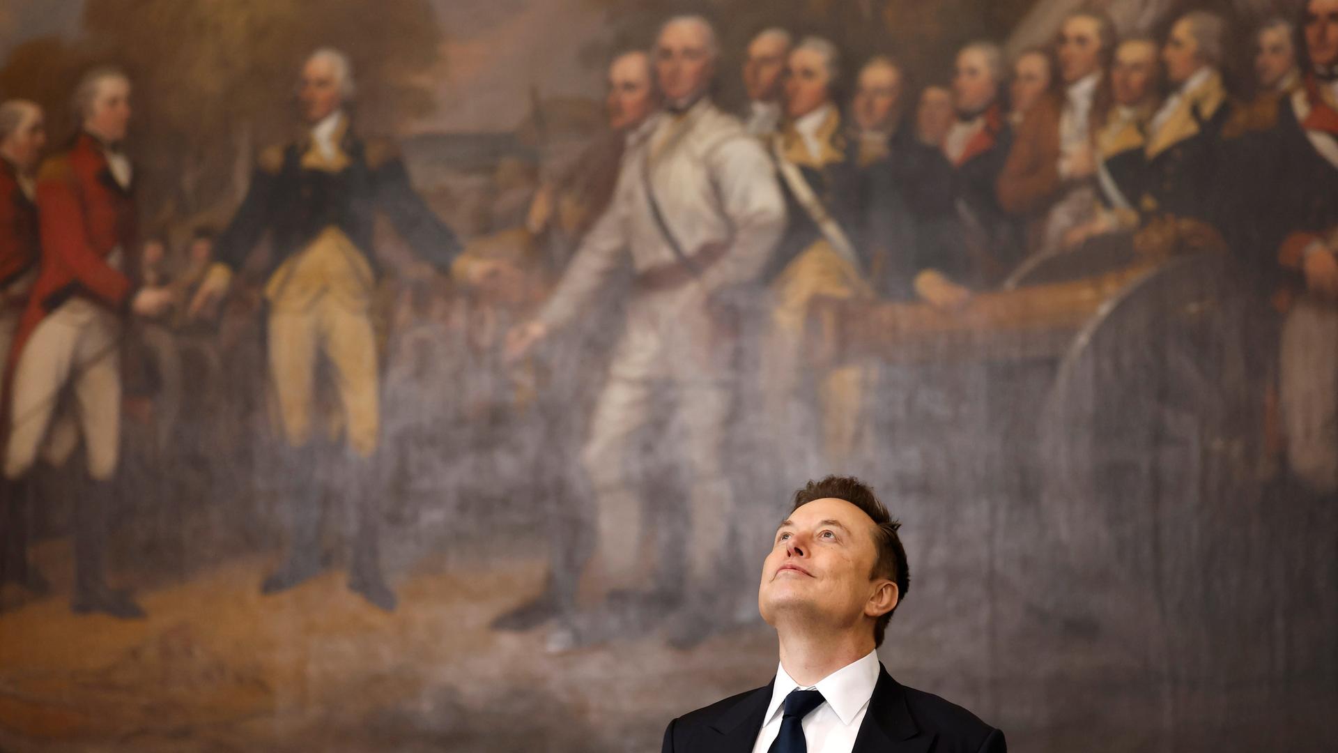 Elon Musk vor dem Gemälde "Kapitulation von General Burgoyne" im US-Kapitol am 20. Januar 2025 bei Donald Trumps Amtseinführung