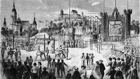 Eine zeitgenössische Zeichnung zeigt eine Ansammlung von Menschen vor der Stadansicht von Coburg.