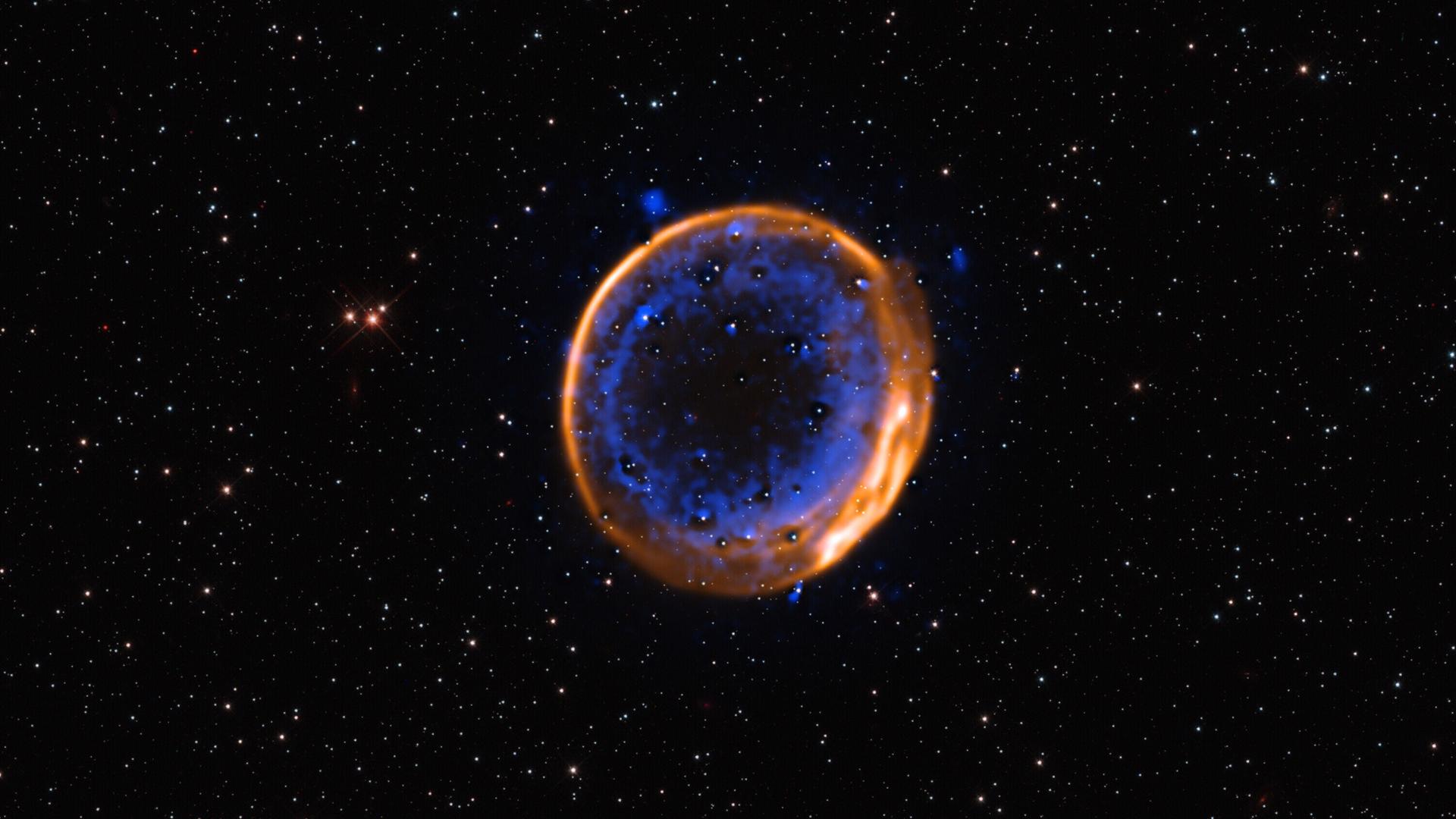 Ein gelber und ein blauer Ring sind im Weltall zu sehen.