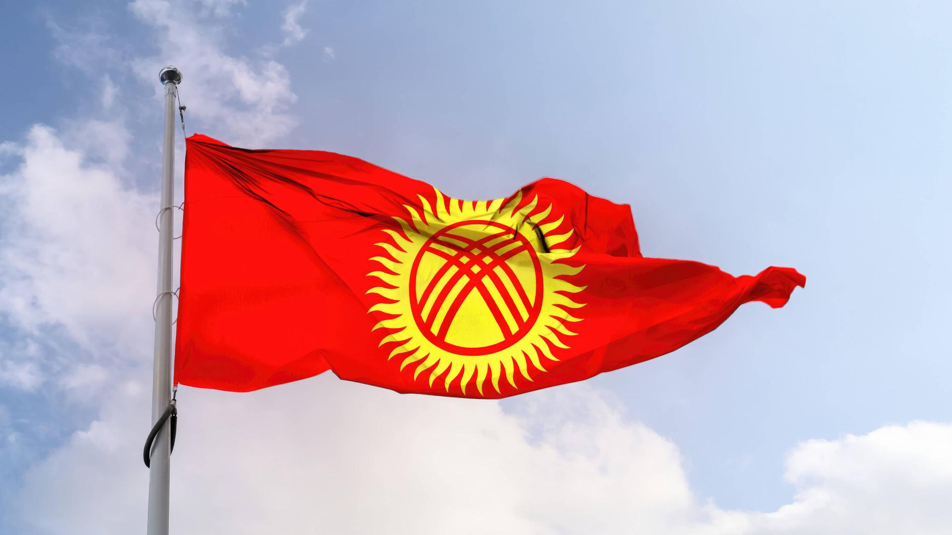 Die Flagge von Kirgisistan Die Flagge von Kirgisistan