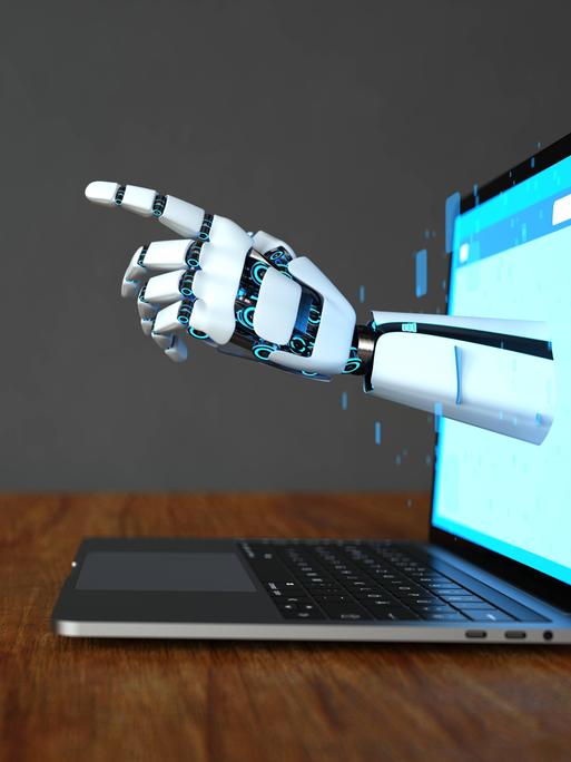 Eine Roboterhand ragt aus einem Computermonitor hinaus
