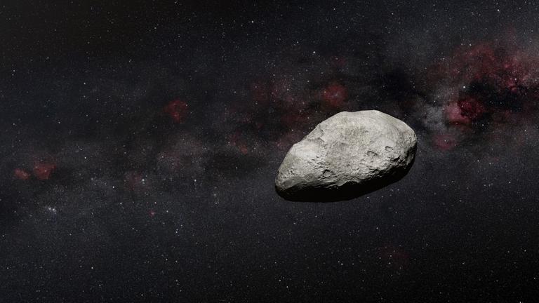 Das Foto zeigt einen Asteroiden, einen großen Fels-Brocken im Weltall.