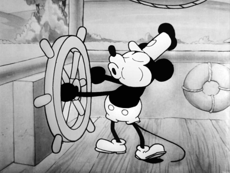 "Steamboat Willie" von 1928 war der erste veröffentlichte Trickfilm mit Comicfigur Micky Maus, hier in einer Szene am Steuerrad eines Schaufelraddampfers 
