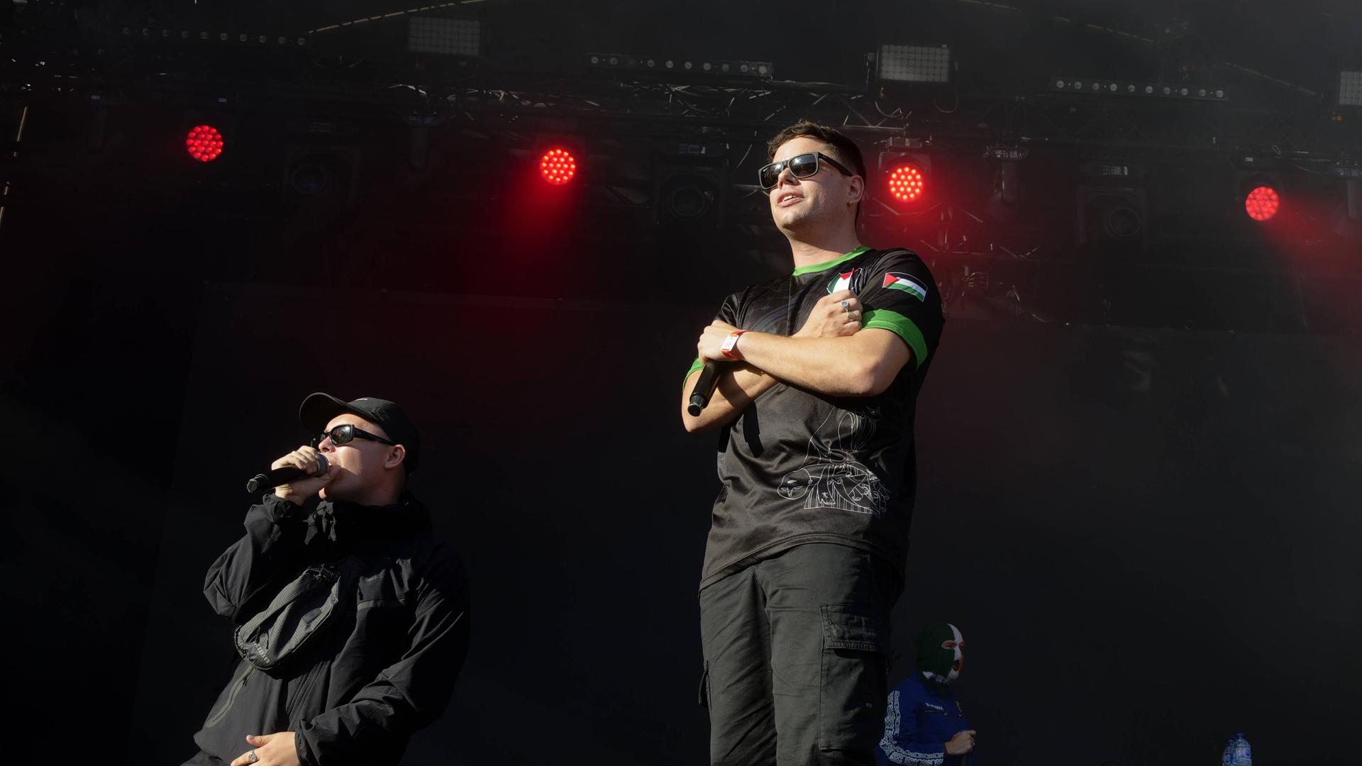 Irish group Kneecap (Mo Chara, Moglaí Bap and DJ Provai) performs live at the Rock en Seine festival at Domaine National Saint-Cloud, in the suburbs of Paris. The concert took place in a tense atmosphere. The Northern Irish trio again denounced Israeli policy in Gaza and criticized the French government for its military aid to Israel. Protesters from the Nous Vironts collective, which fights against anti-Semitism, disrupted the start of the concert by holding signs reading "Anti-Semites, out of our parties." They were removed by security services.Saint-Cloud, France 08/24/2025 Le groupe irlandais Kneecap ( Mo Chara, Moglaí Bap et DJ Provai) en concert lors du festival Rock en Seine au Domaine National de Saint-Cloud pres de Paris. Saint-Cloud, France 24/08/2025.Le concert s est deroule dans une ambiance tendue. Le trio nord irlandais a de nouveau denonce la politique israelienne à Gaza et a critique le gouvernement francais pour son aide militaire a Israel. Des manifestants du collectif Nous vivrons, luttant contre l antisemitisme, ont perturbe le debut du concert en brandissant des panneaux ou Ã'tait inscrit Antisemites, hors de nos fetes. Ils ont ete exfiltres par les services de securitÃ'. Saint-Cloud, France 08/24/2025 //SADAKA_sada016/Credit:SADAKA EDMOND/SIPA/2508250030