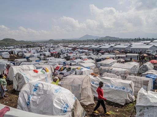 People displaced by the ongoing fighting between Congolese forces and M23 rebels gather in a camp on the outskirts of Goma, Democratic Republic of Congo