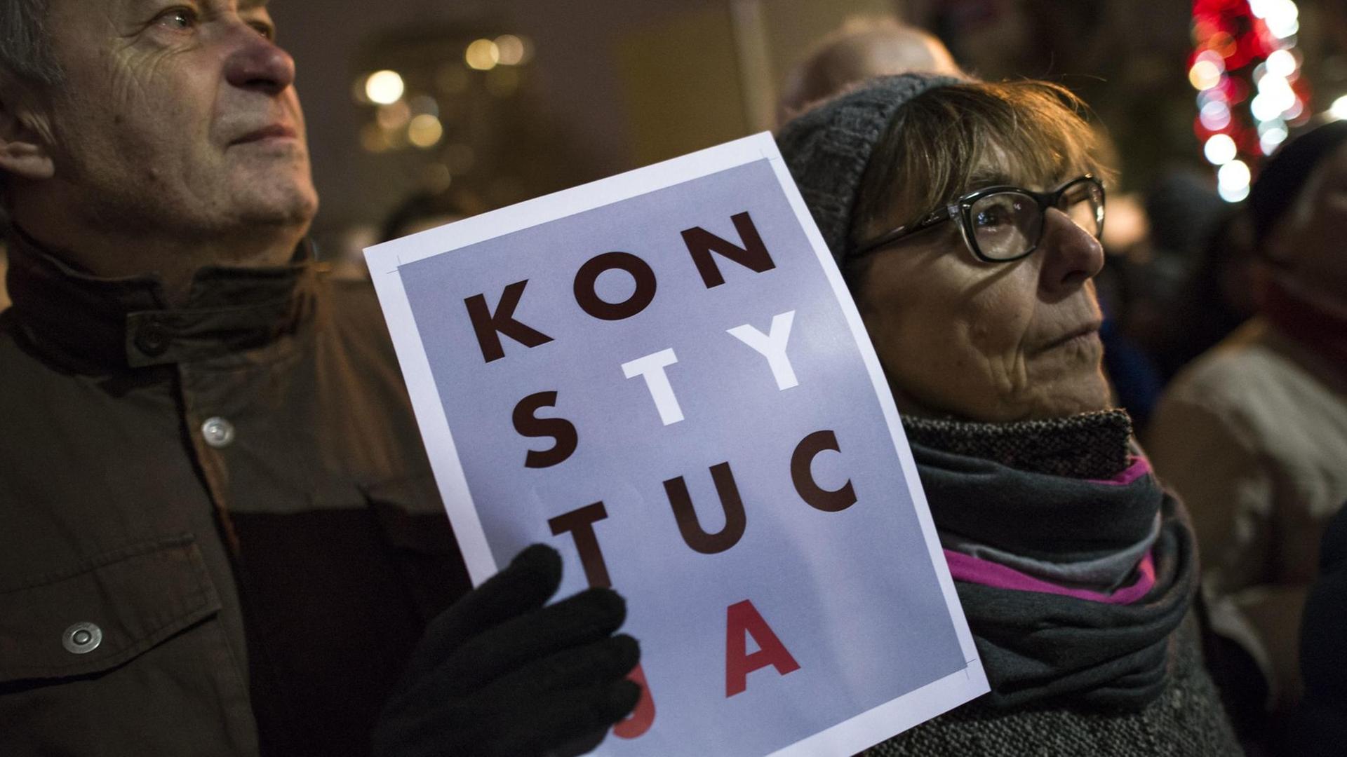 December 18, 2019, Warsaw, Poland: A protester holds a placard saying Constitution during the demonstration..Thousands of people protested outside the Parliament and in 130 cities across Poland. Protests were held under the slogan ''Today judges, you tomorrow''. The protests concern the draft amendment to the law on common courts and the Supreme Court which provides for the possibility of disciplining judges and dismissing them from the profession those who will challenge the actions of the new National Council of the Judiciary or other judges. Law and Justice (PiS) MPs who submitted this bill to the Polish Sejm (Parliament) also want to reduce the independence of the Supreme Administrative Court. If the new regulations come into force, it's the President, and not the general assembly of judges of the Supreme Administrative Court will decide on the internal system of the court. (Credit Image: © Attila Husejnow/SOPA Images via ZUMA Wire |