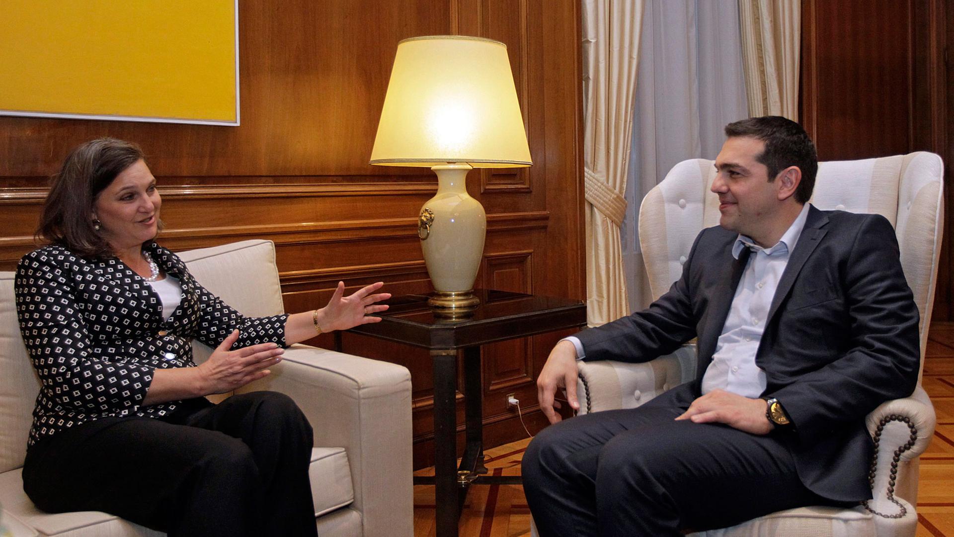 Greek Prime Minister Alexis Tsipras (R) talks with Victoria Nuland (L), Assistant Secretary of State for European and Eurasian Affairs at the United States Department of State, in Athens on 17 March 2015. Victoria Nuland is in Athens on one-day working visit.