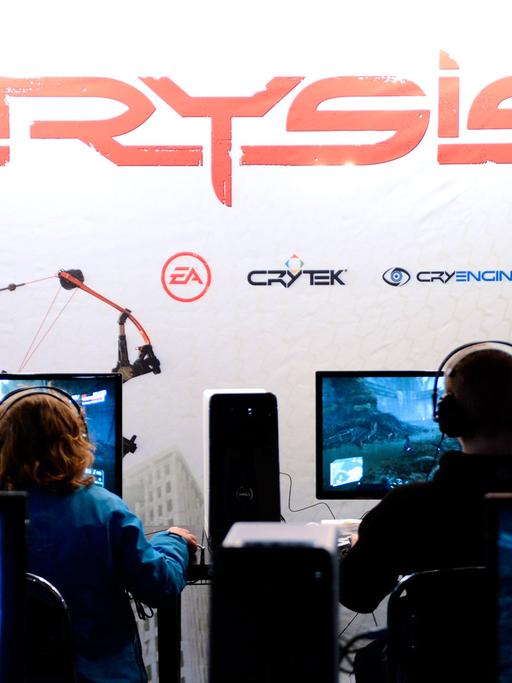 Computer gamers try the new and under develpment Crysis 3 computer game on November 1, 2012 during the Gamex fair at Kistamassan exhibition and event venue in Stockholm.