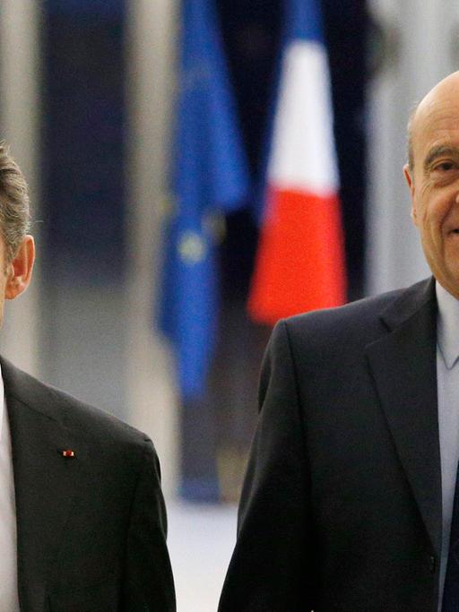 Nicolas Sarkozy und Alain Juppé sind die bekanntesten Gesichter der neuen konservativen Partei "Les Républicains" − und Rivalen um die Präsidentschaftskandidatur.
