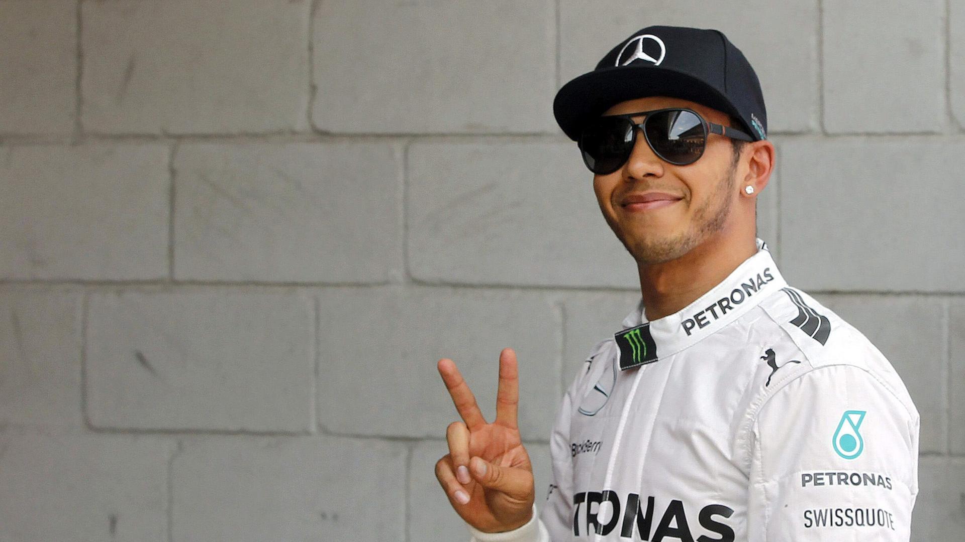 epaselect epa04199565 British driver Lewis Hamilton of Mercede flashes a V-sign after placing first in the qualifying session for Spain's Formula One Grand Prix at Catalunya racetrack in Montmelo, Barcelona province, Catalonia, north-eastern Spain, 10 May epaselect epa04199565 British driver Lewis Hamilton of Mercede flashes a V-sign after placing first in the qualifying session for Spain's Formula One Grand Prix at Catalunya racetrack in Montmelo, Barcelona province, Catalonia, north-eastern Spain, 10 May