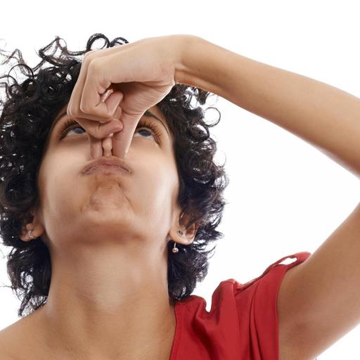 hispanic woman holding breath closing nose with fingers on white background model released Symbolfoto PUBLICATIONxINxGERxSUIxAUTxONLY Copyright: xdiego.cervox Panthermedia10888428