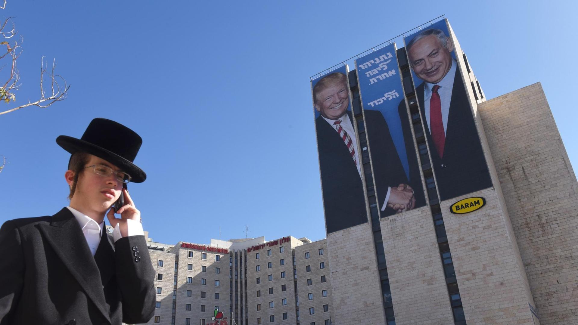 An Ultra-Orthodox Jew walks past a giant election campaign billboard of U.S. President Donald Trump (L) and Israeli Prime Minister Benjamin Netanyahu ( R) shaking hands, at the entrance to Jerusalem, February 4, 2019. The Hebrew writing on the billboard reads " Netanyahu, in another league." Israelis will go to the polls in an early election on April 9, 2019. Photo by Debbie Hill/UPI Photo via Newscom picture alliance |