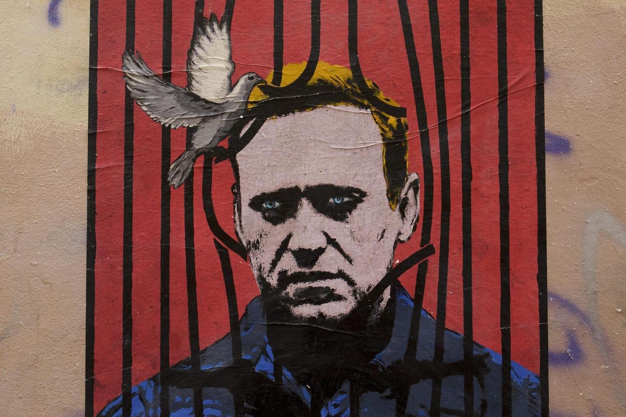 A work by the street artist Harry Greb, depicts Russian opposition leader Alexei Navalny behind bars with a dove freeing him from detention, on a wall in downtown Rome, Italy, 25 January 2021