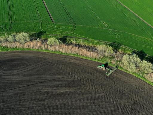 6531018 28.04.2021 An aerial view shows sugar beet sowing underway in fields of the Krasnodar region, in Russia. Vitaly Timkiv / Sputnik