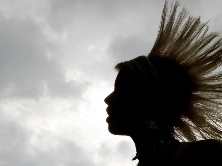 A woman is seen attending the 'Rock to the Park' music festival in Bogota, Colombia, 04 July 2010.