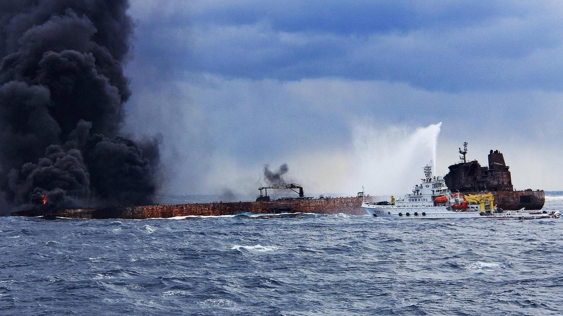 Rescuers spray foam to extinguish flames on the stricken oil tanker SANCHI off the coast of east China s Shanghai, Jan. 12, 2018.