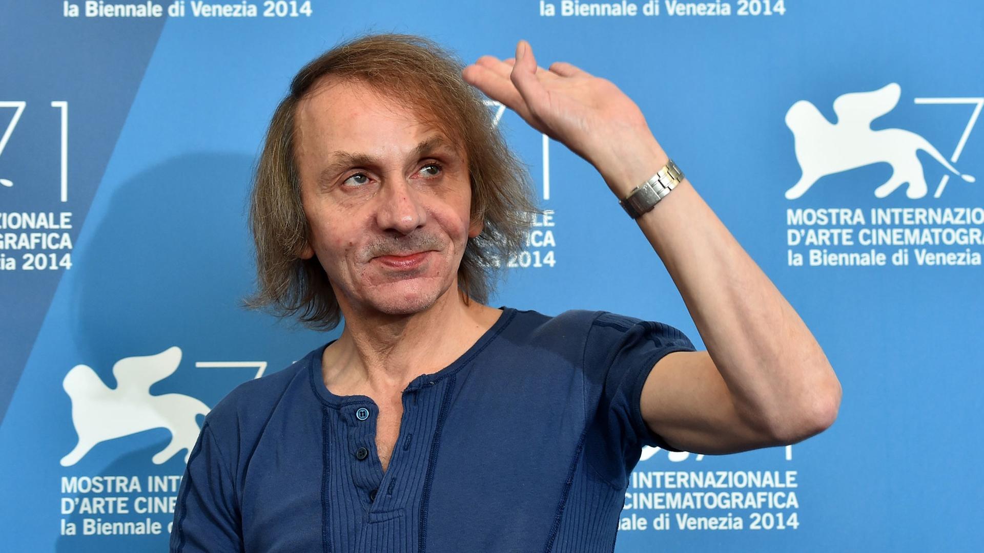 French writer Michel Houellebecq poses during the photocall of the movie "Near Death Experience" presented in the Orizzonti selection at the 71st Venice Film Festival on September 1st, 2014