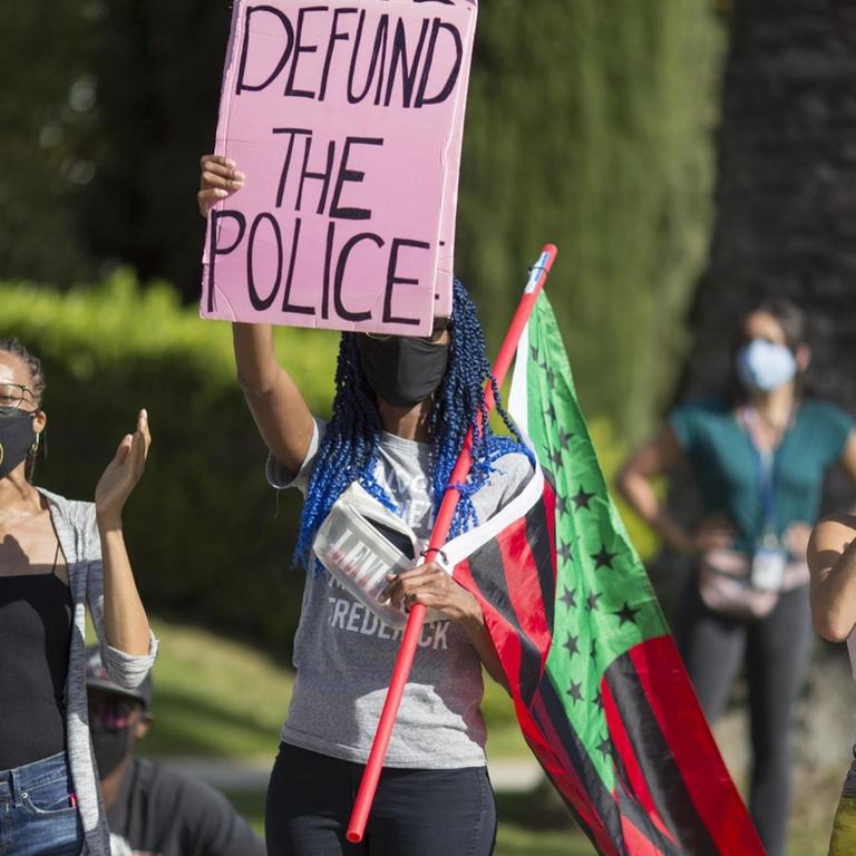 People protest outside Los Angeles Mayor Garcetti's house after a guilty verdict was announced at the trial of former Minneapolis police Officer Derek Chauvin for the 2020 death of George Floyd, Tuesday, April 20, 2021, in Los Angeles. Former Minneapolis police Officer Derek Chauvin has been convicted of murder and manslaughter in the death of Floyd. (AP Photo/Ringo H.W. Chiu)