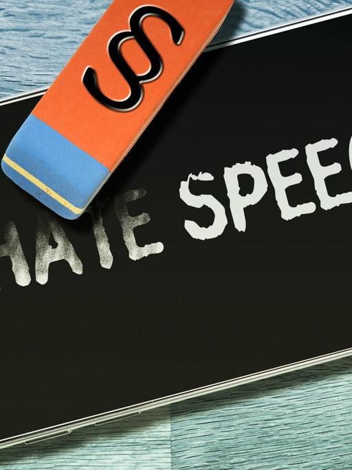 Der Schriftzug "Hate Speech" auf einem Handydisplay wird wegradiert, Symbolfoto zum Netzwerkdurchsetzungsgesetz *** The writing "hate speech" on a cell phone s display is erased. icon photo for the planned network enforcement law