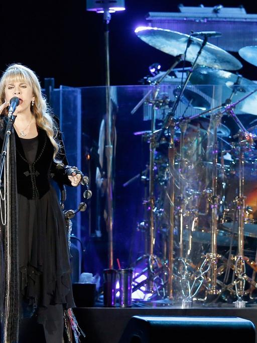 Bass player John McVie, singer Stevie Nicks and drummer Mick Fleetwood of British-American rock band Fleetwood Mac performs on stage at the Hallenstadion in Zurich, Switzerland, 13 October 2013.