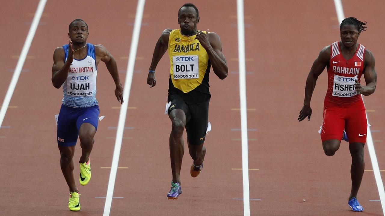 Der Brite Chijindu Ujah, der Jamaikaner Usain Bolt imd Andrew Fisher aus Bahrain vom Halbfinale des 100-Meter-Laufs bei der Leichtathletik-WM in London.