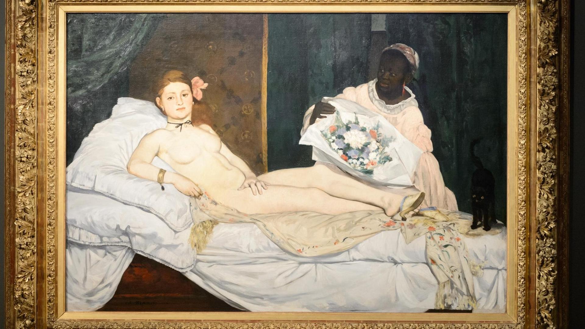 Edouard Manets Gemälde "Olympia" zeigt links im Bild eine weiße, nackte Frau, die in einem Bett liegt und rechts im Bild eine schwarze Frau mit Blumenstrauß.