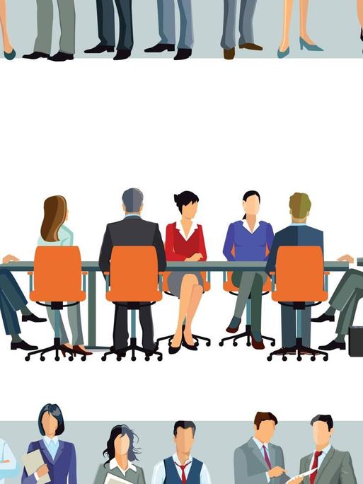 Mitarbeiter sitzen zusammen an einem großen Konferenztisch - umringt von weiteren, stehenden Mitarbeitern.