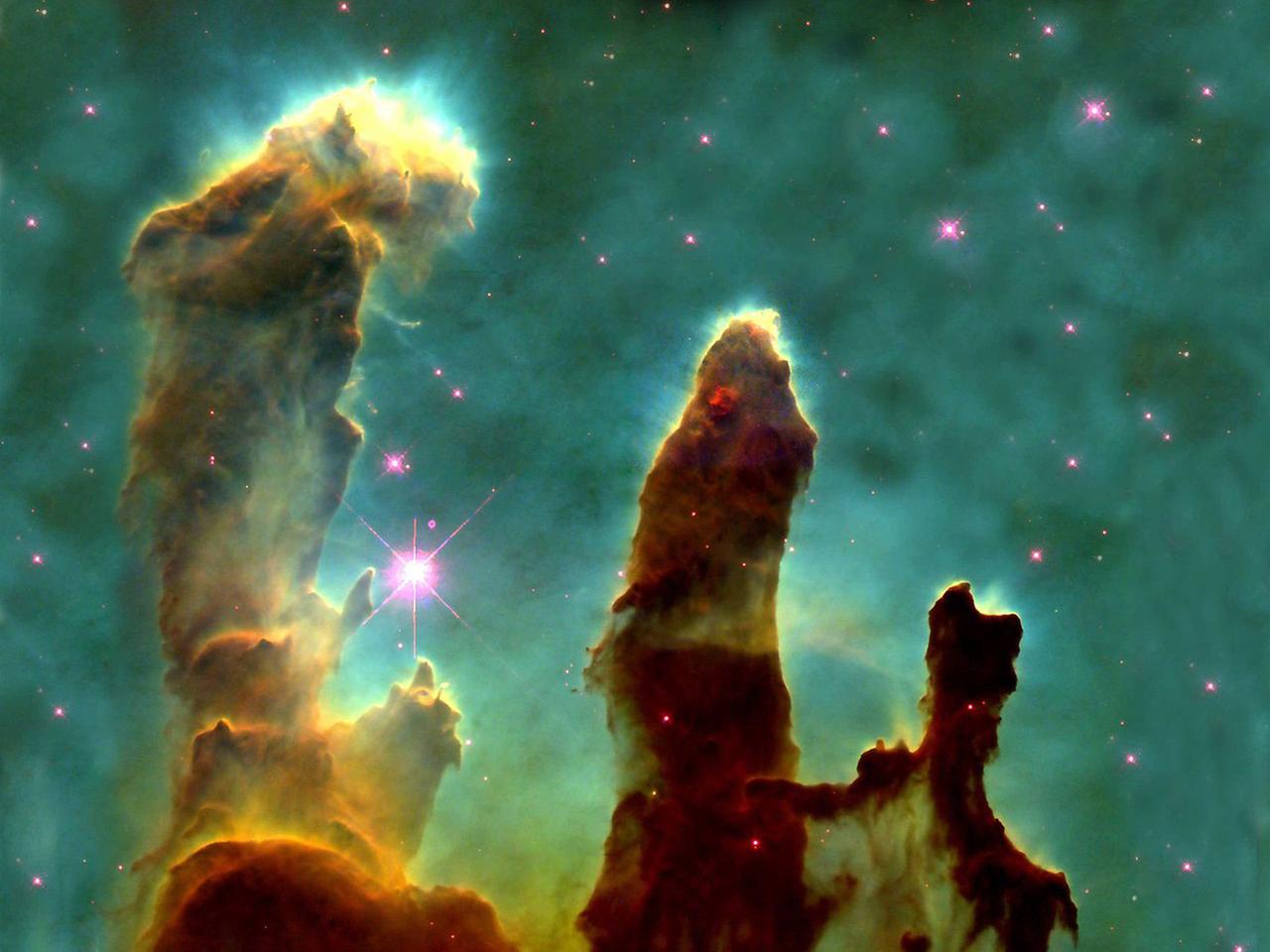 M16 mit den berühmten "Säulen der Schöpfung" - eine Hubble-Ikone 