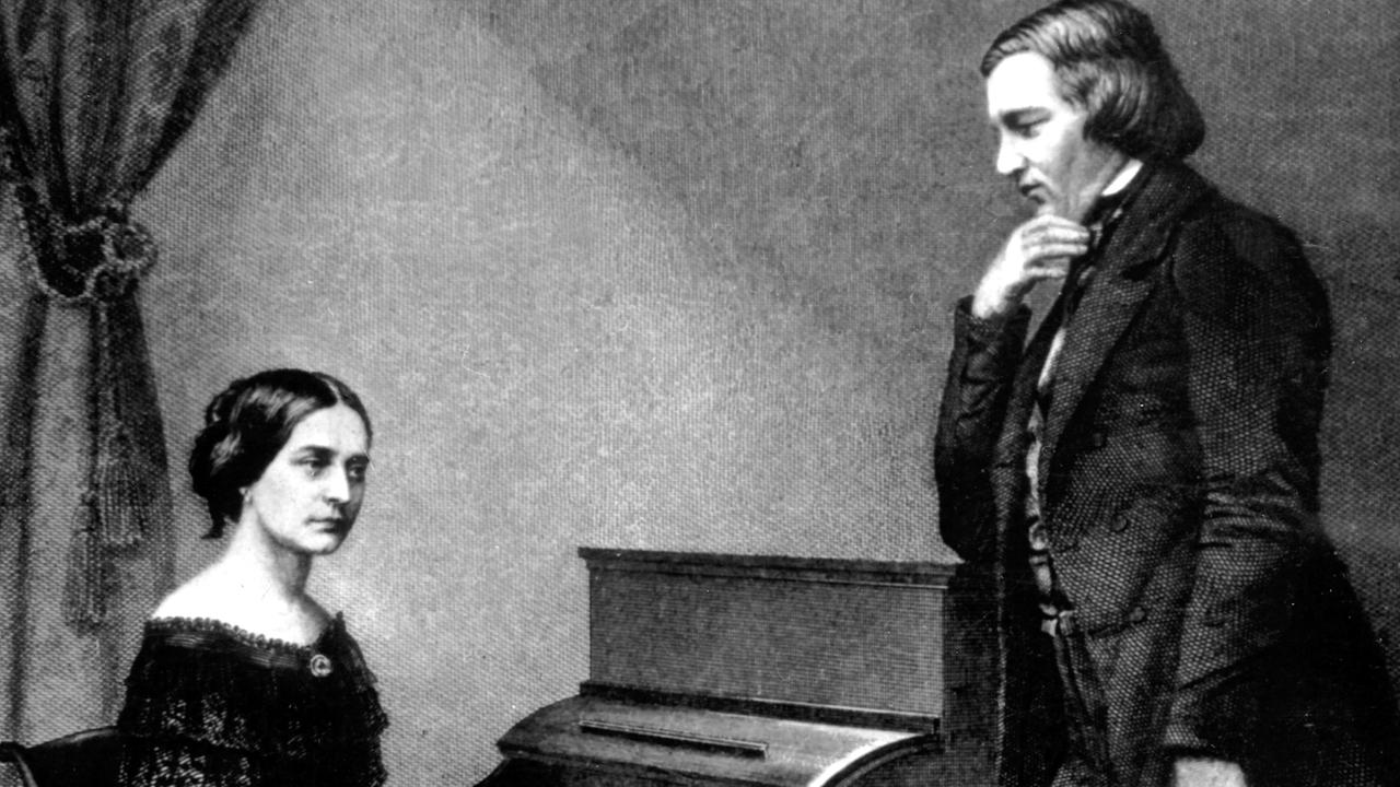 Clara Schumann, geborene Wieck, mit ihrem Mann, dem Komponisten Robert Schumann auf einer zeitgenössischen Darstellung am Klavier sitzend.