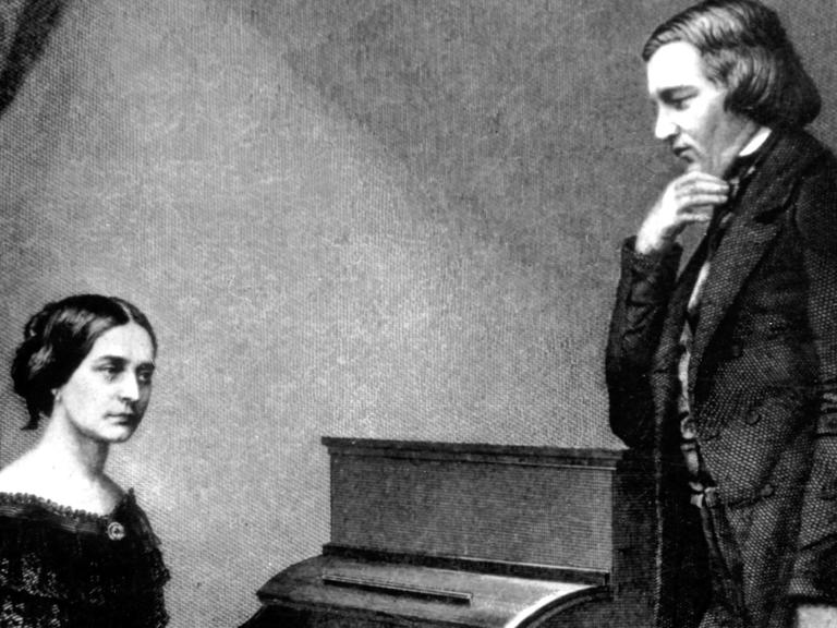 Clara Schumann, geborene Wieck, mit ihrem Mann, dem Komponisten Robert Schumann auf einer zeitgenössischen Darstellung am Klavier sitzend.