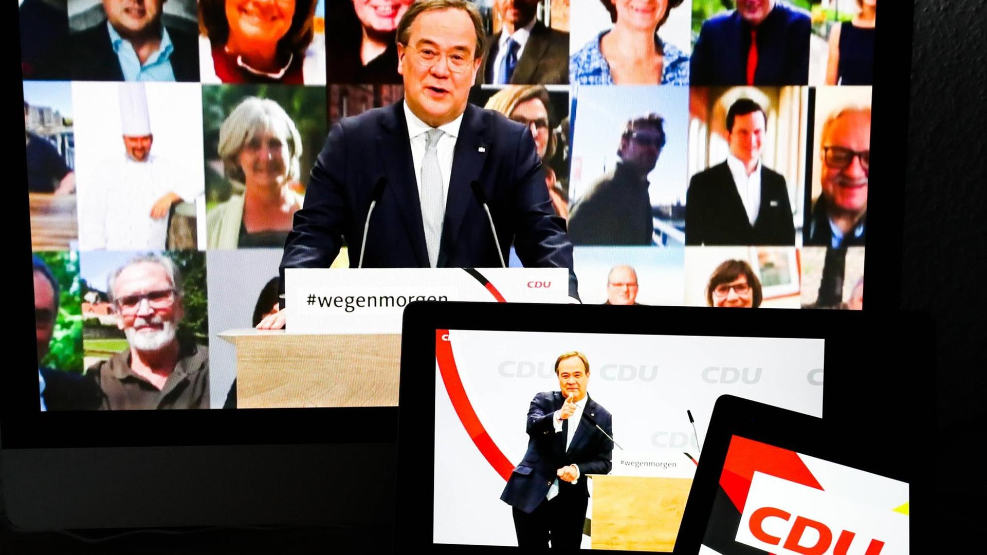 Armin Laschet ist auf mehreren Bildschirmen auf dem digitalen Parteitag der CDU zu sehen.