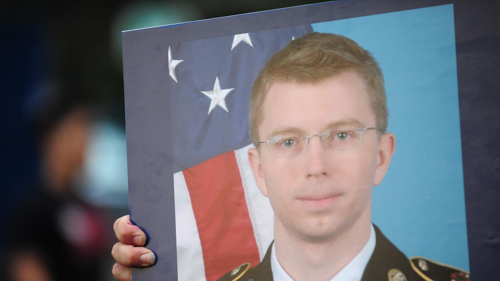 A picture of Bradley Manning is held out to passing motorists on the day he was sentenced to 25 years in prison...Photo: Alex Milan Tracy/NurPhoto A picture of Bradley Manning is held out to passing motorists on the day he was sentenced to 25 years in prison...Photo: Alex Milan Tracy/NurPhoto
