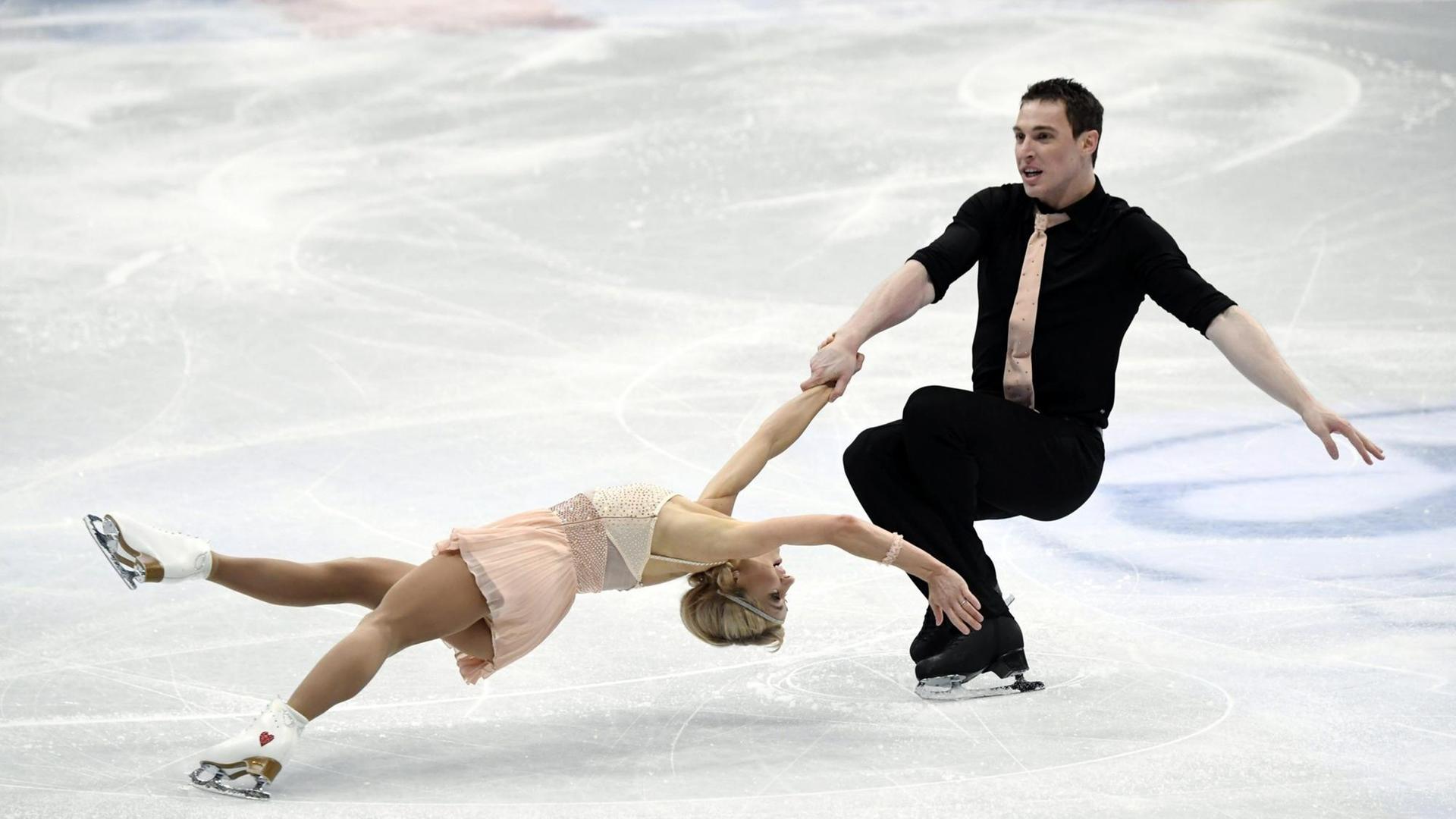 Aliona Savchenko and Bruno Massot of Germany perform their routine during the pairs' short program at the ISU World Figure Skating Championships in Helsinki, Finland, on March 29, 2017. LEHTIKUVA / MARKKU ULANDER - FINLAND OUT. NO THIRD PARTY SALES. |