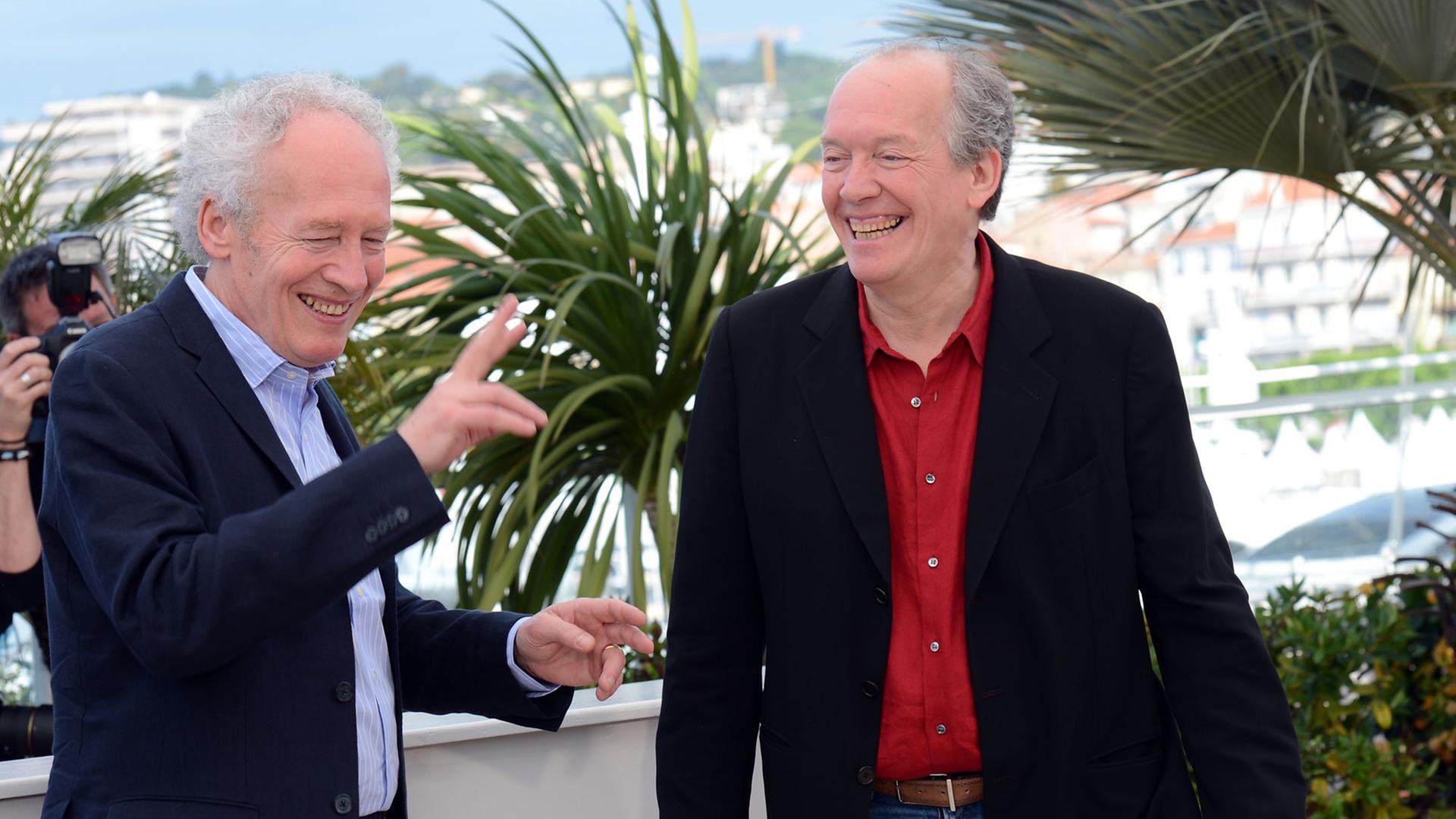 Film directors Jean-Pierre Dardenne, left, and Luc Dardenne at the photocall for the film Two Days, One Night (Deux Jours, Une Nuit) during the 2014 Cannes Film Festival.