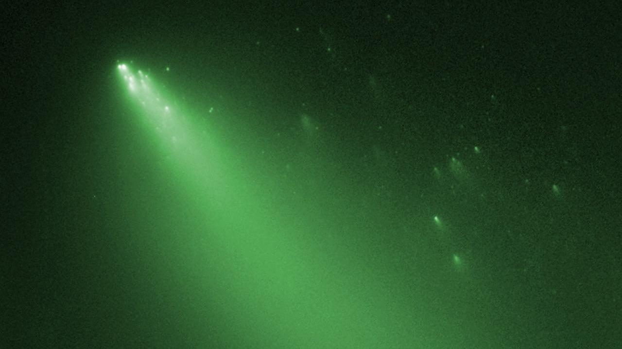 Der zerfallende Komet Schwassmann-Wachmann 3, fotografiert 2006 vom Hubble-Weltraumteleskop (Falschfarbendarstellung) (NASA/ESA)
