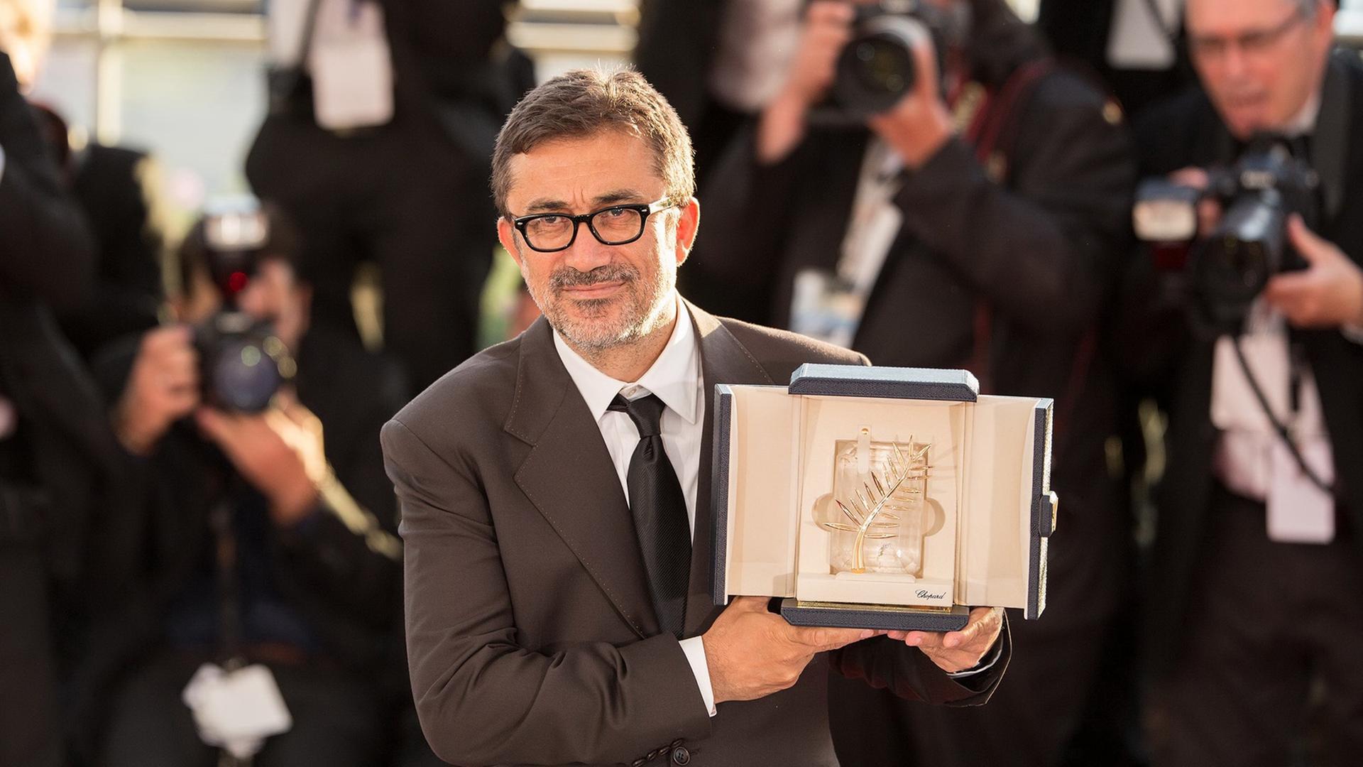 Der türkische Filme-Macher Nuri Bilge Ceylan hat die Goldene Palme für seinen Film "Winter-Schlaf" gewonnen Der türkische Filme-Macher Nuri Bilge Ceylan hat die Goldene Palme für seinen Film "Winter-Schlaf" gewonnen