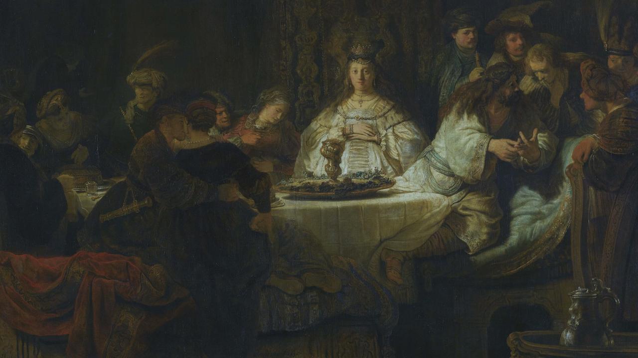 Samson sitzt neben seiner Braut an der Hochzeitstafel und gibt ein Rätsel auf – gemalt von Rembrandt.