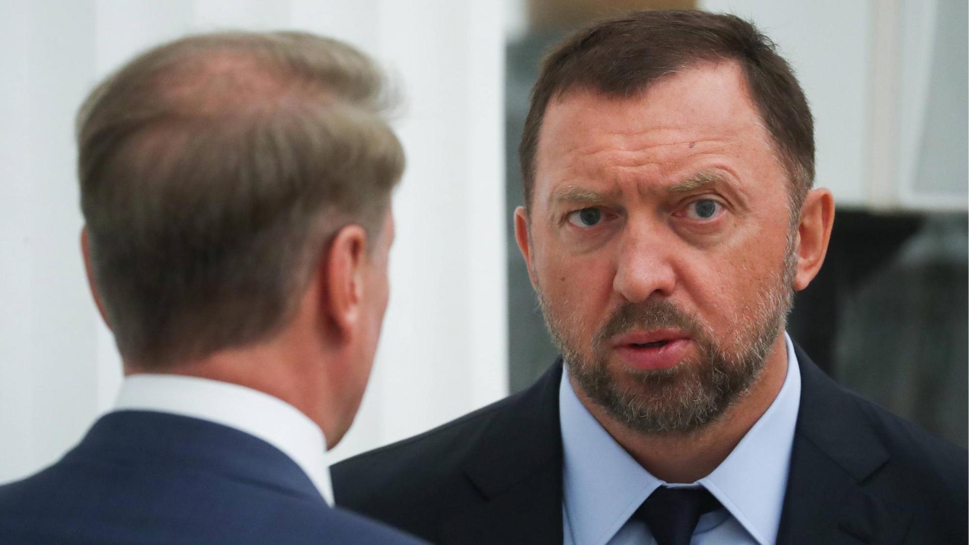 Sberbank CEO and Chairman of the Executive Board German Gref (L) and Rusal President and Management Board Member Oleg Deripaska talking ahead of a meeting of Russian President Vladimr Putin with Russian businessmen at the Moscow Kremlin.