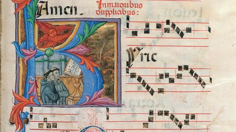 Verzierte Seite eines Chorbuches mit liturgischem Gesang, mit einer kleinen Illustration zweier Mönchsfiguren.
