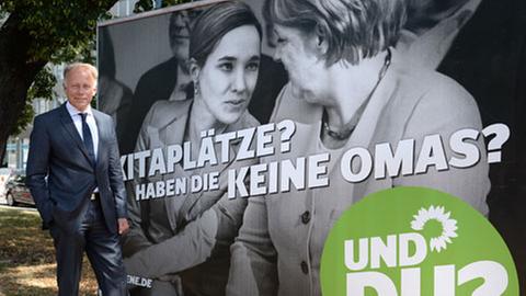 Jürgen Trittin (Bündnis 90 / Die Grünen) vor einem Wahlplakat, August 2013