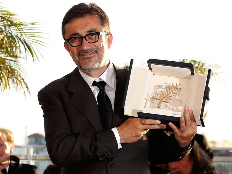 Turkish director Nuri Bilge Ceylan poses during the Award Winners photocall after he won the Palme d'Or (Golden Palm) award for his movie 'Winter Sleep' at the 67th annual Cannes Film Festival in Cannes, France