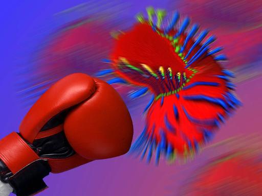 Ein Boxhandschuh wehrt den Angriff eines Virus ab.